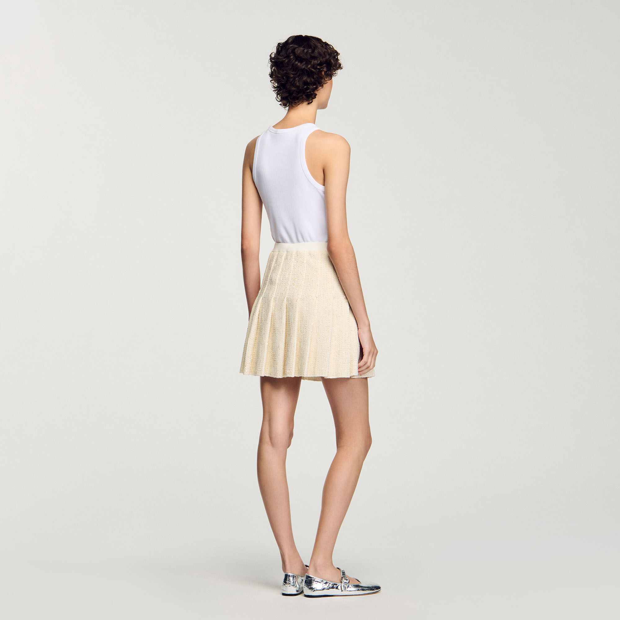 Falda corta plisada de tweed